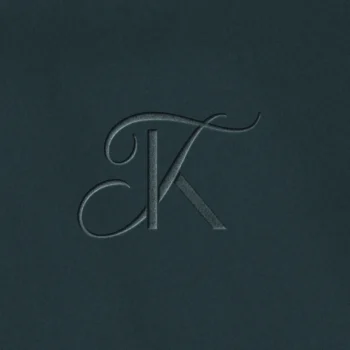 KT & TK Monogram logo | Wedding letter logo design Embossed KT and TK letter logo as premium initials design on blue background for luxury wedding stationery and quality print