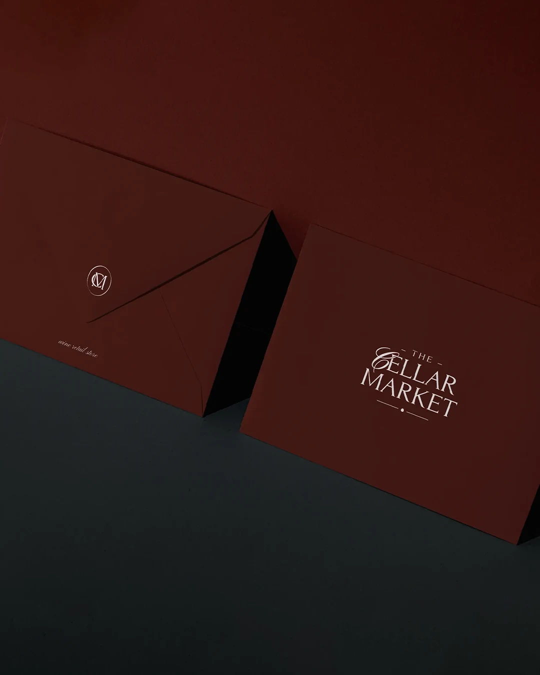 vertical branded envelopes wine monogram Vertical view of branded envelopes featuring the custom wine store monogram