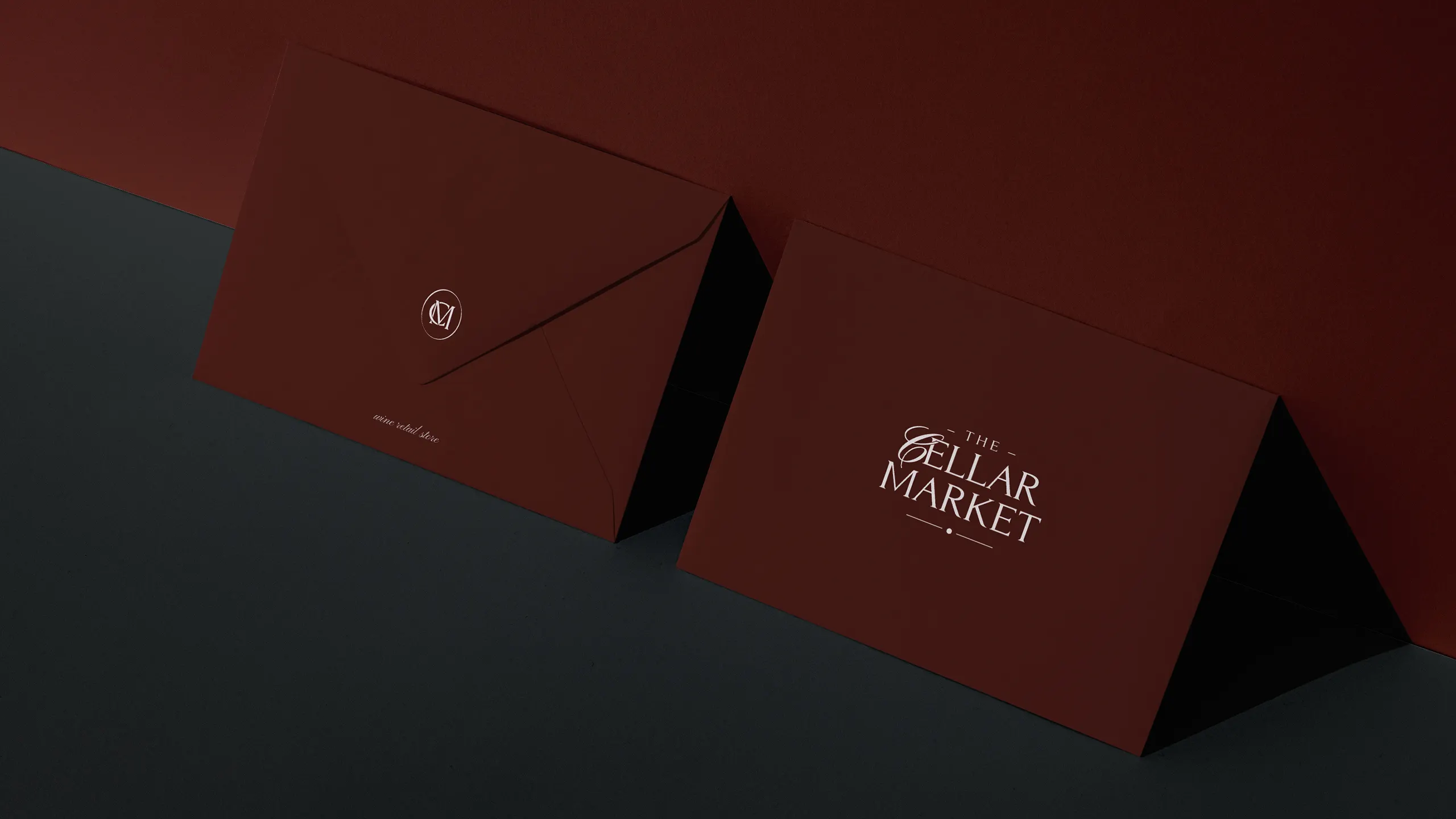 wine store monogram logo stationery envelopes Wine store monogram logo on premium stationery envelopes for corporate identity