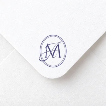 Blue AM & MA initials logo with interlocking letters on rich paper envelope for premium wedding décor and personal branding