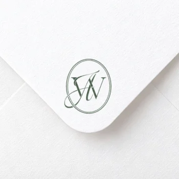 Green WA & AW initials logo with interlocking letters on rich textured paper for sophisticated wedding décor