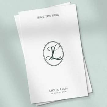 Green LL letter logo as premium initials design on a textured save the date card for luxury wedding stationery & embossing