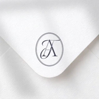 Purple TA & AT letter logo as minimalist initials design on a textured envelope for luxury weddings, sophisticated branding