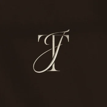Silver TJ & JT letter logo as premium initials design on a rich brown background for luxury wedding stationery & embossing