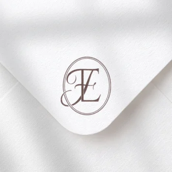 Burgundy EF and FE letters as luxury initials logo design on a textured envelope for premium wedding invites and mailing