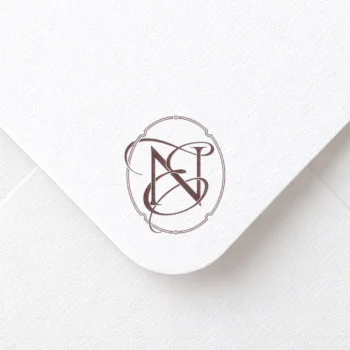 Burgundy NE and EN letter logo as refined initials design on textured envelope for premium wedding invites, mailing, print
