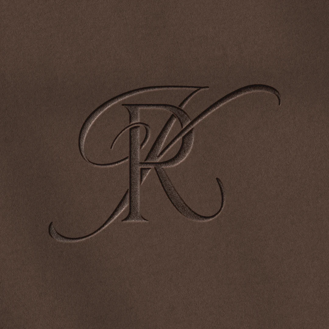 RK & KR Monogram | Wedding letter logo design Embossed RK and KR letter logo as refined initials design on rich brown background for elegant wedding stationery, wax seals