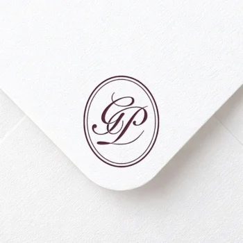 Rich burgundy GP letters as stylish initials logo design on a light textured envelope for refined stationery suites, wedding décor, letterpress and high-quality print