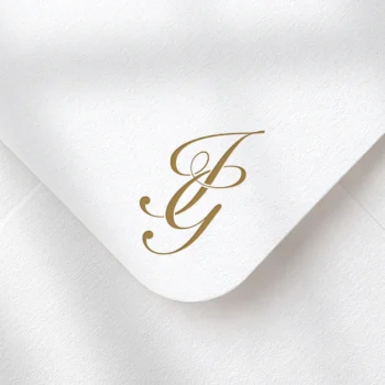 Golden brown IG letters as stylish initials logo design on a light textured envelope for luxury stationery suites, wedding décor, letterpress and high-quality print