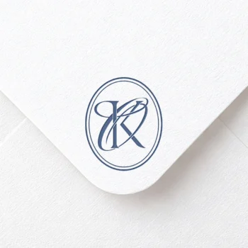 Light navy blue KO and OK letters as stylish initials logo design on a light textured envelope for refined stationery suites, wedding décor and high-quality print