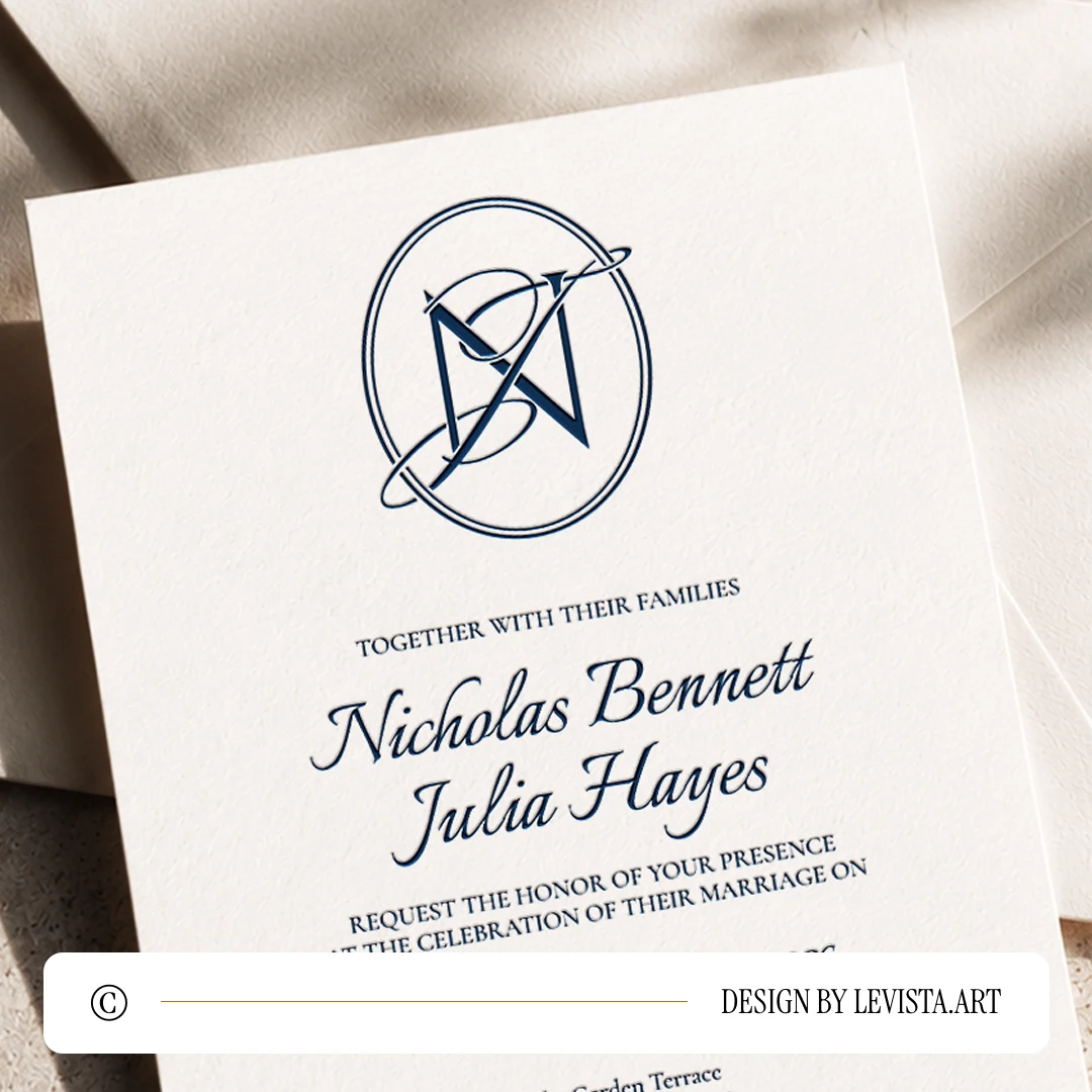 Navy blue NJ and JN wedding monogram with elegant interlocking letters of semi-bold N and thin J as premium modern initials logo design with couple names on an invitation card lying on a light envelope over sandstone for stationery suites, invites and letterpress